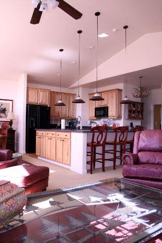 46 Pine Ridge Road, Unit 5 Basalt, CO 81621 - Photo 5 of 9 a living room with lots of furniture and a flat screen tv