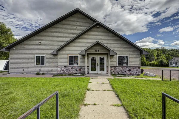 a front view of house with yard patio and green space
