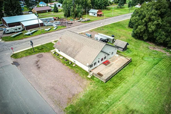an aerial view of a house with a yard