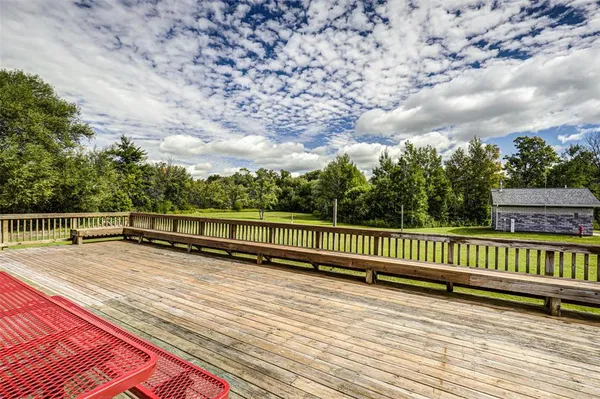 a view of wooden deck with a bench