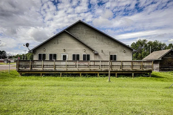 a front view of a house with a yard table and chairs