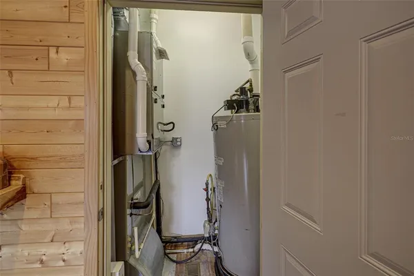 a view of storage and utility room with racks on the wall