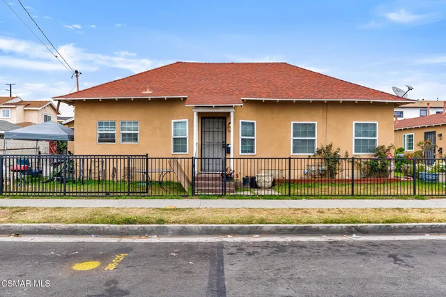 a front view of a house with a patio
