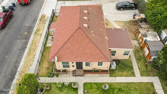 an aerial view of a house with outdoor space