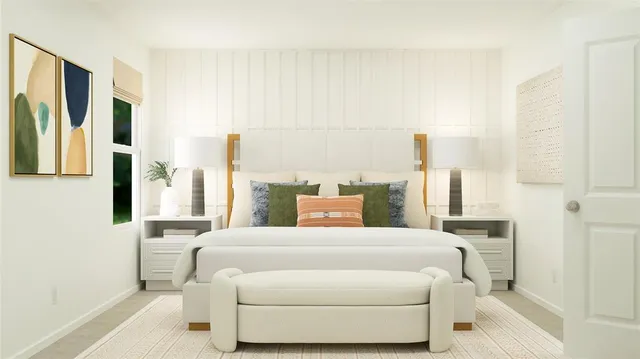 a bedroom with a large bed and a large window