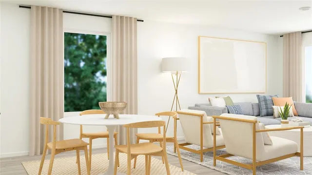 a dining room with furniture and window