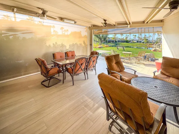a view of a terrace with furniture and a table
