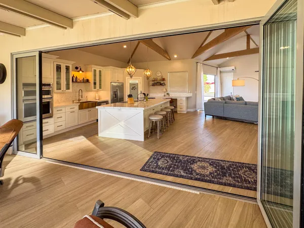 a view of living room with kitchen and furniture