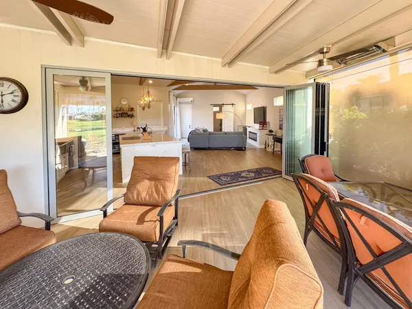 a view of a living room and dining room
