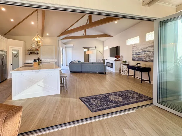 a living room with furniture and a rug