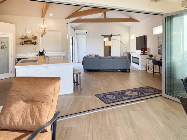 a living room with furniture and a rug