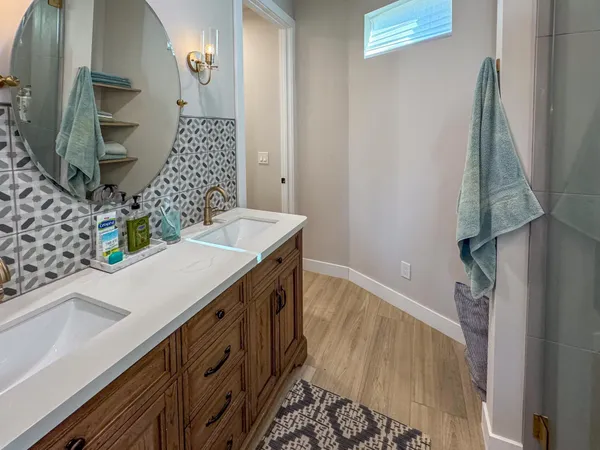a bathroom with a sink and a mirror