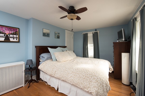 28 Partridge Road Weymouth, MA 02190 - Photo 13 of 22 a bedroom with a bed and a chandelier