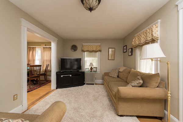 28 Partridge Road Weymouth, MA 02190 - Photo 2 of 22 a living room with furniture and a flat screen tv