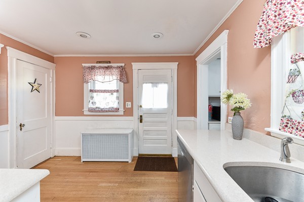 28 Partridge Road Weymouth, MA 02190 - Photo 7 of 22 a kitchen with a sink and a large mirror