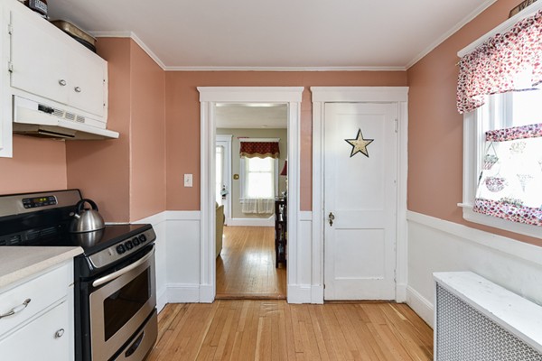 28 Partridge Road Weymouth, MA 02190 - Photo 8 of 22 a kitchen with a refrigerator and a stove top oven