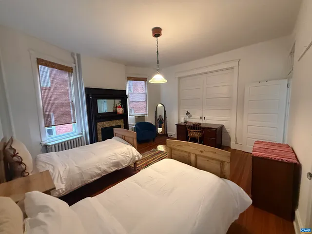 a bedroom with bed and flat tv