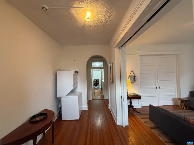 a view of a livingroom with furniture and wooden floor