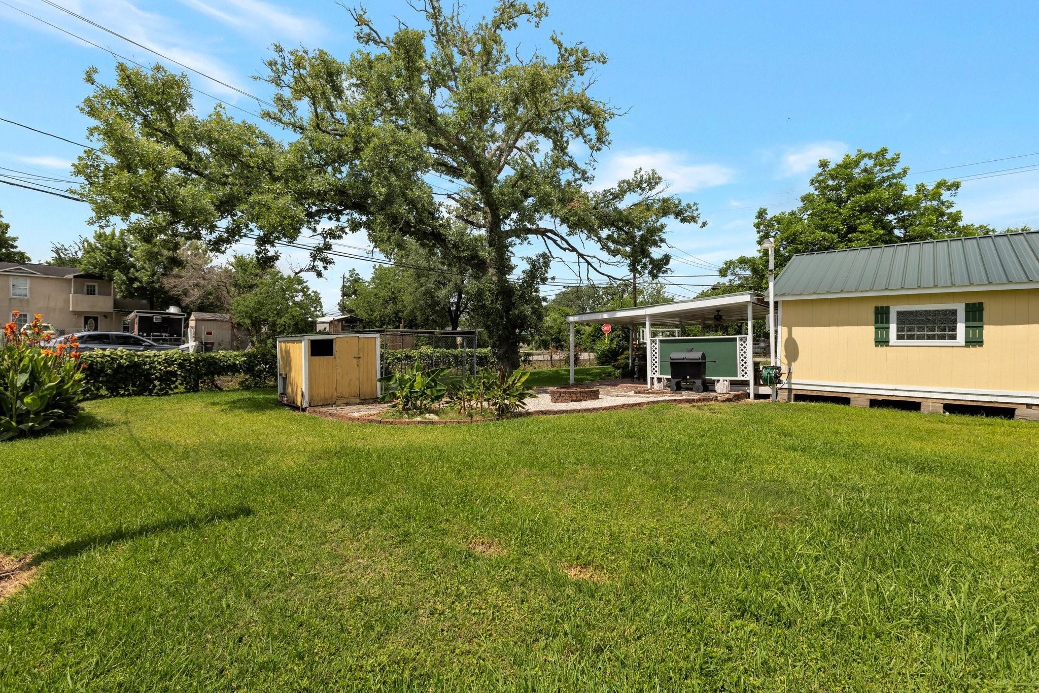 639 Manor Street Houston, TX 77015 - Photo 14 of 31 a front view of a house with a garden and sitting area