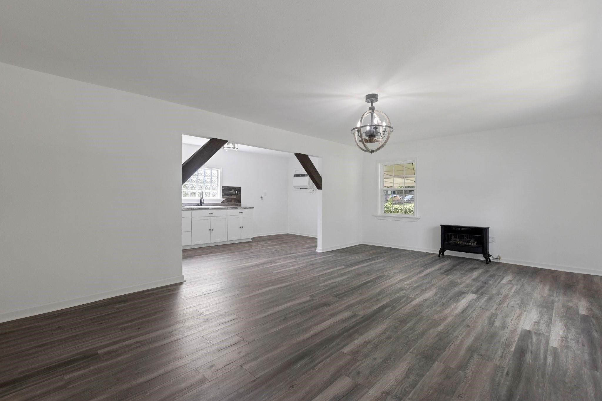639 Manor Street Houston, TX 77015 - Photo 15 of 31 wooden floor in an empty room with a window