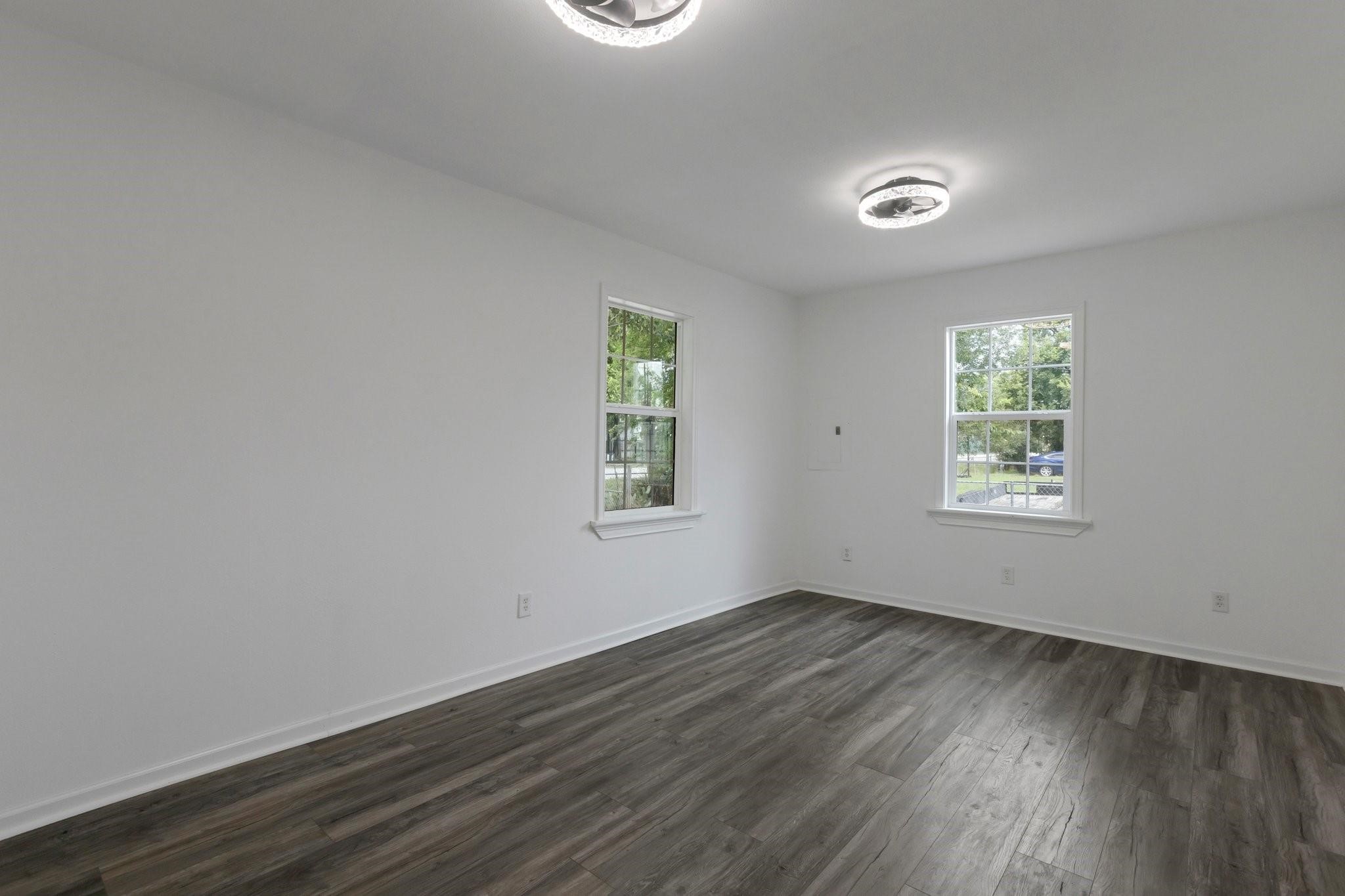 639 Manor Street Houston, TX 77015 - Photo 21 of 31 an empty room with wooden floor and windows
