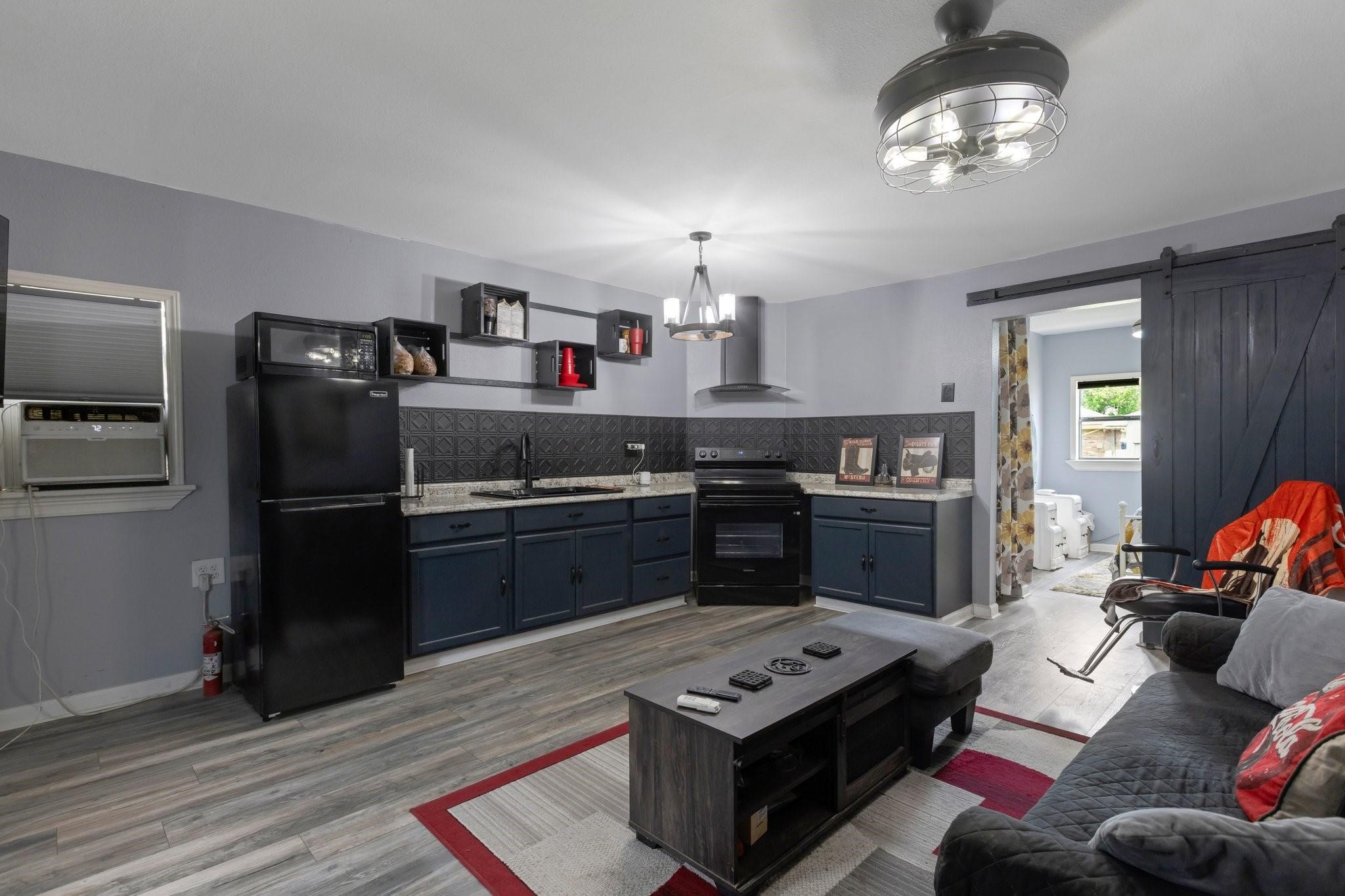 639 Manor Street Houston, TX 77015 - Photo 28 of 31 a kitchen with stainless steel appliances granite countertop a stove refrigerator and microwave