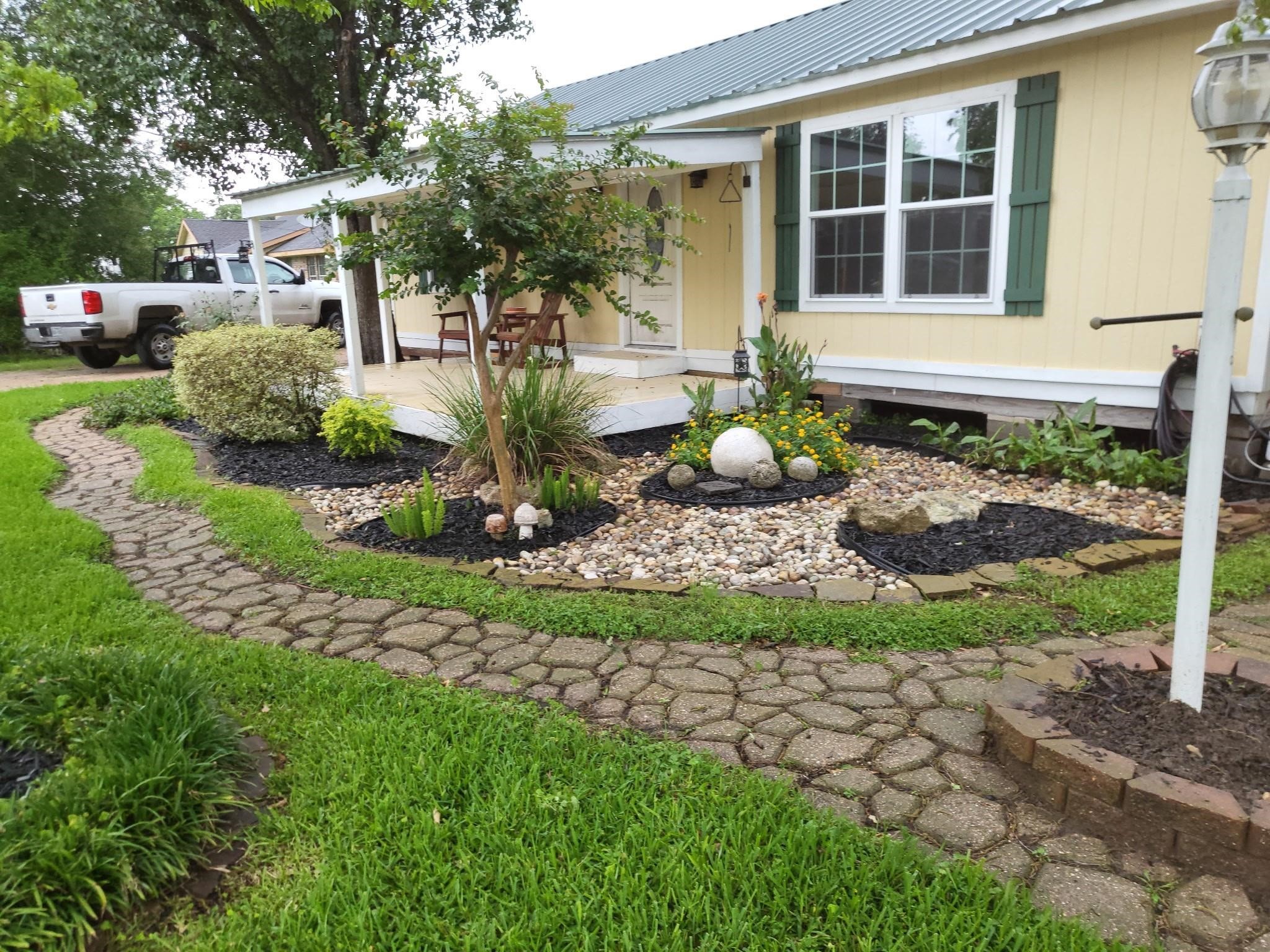 639 Manor Street Houston, TX 77015 - Photo 3 of 31 a front view of a house with a yard and potted plants