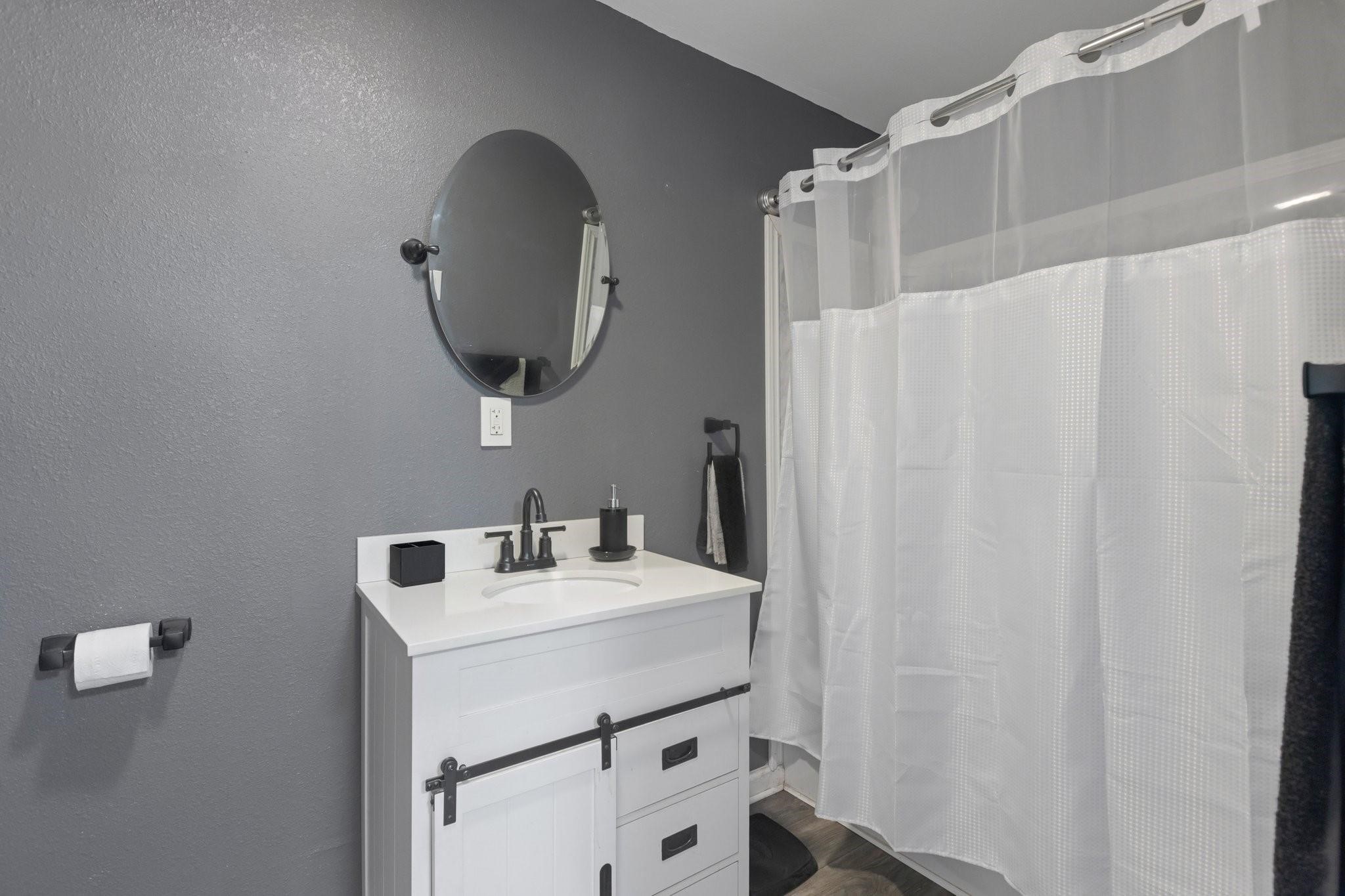 639 Manor Street Houston, TX 77015 - Photo 31 of 31 a bathroom with a sink vanity and a mirror