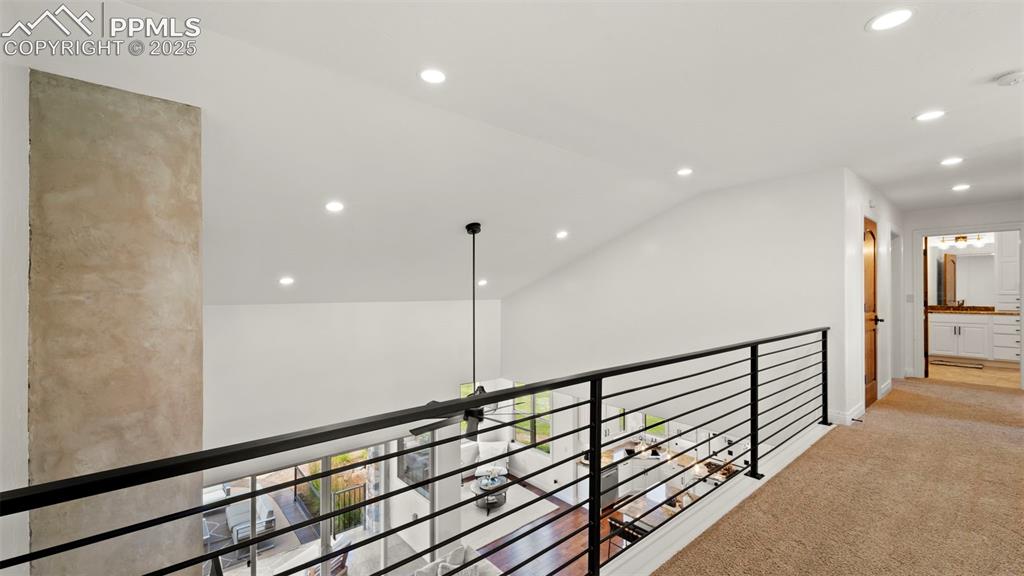 13625 Random Ridge View Colorado Springs, CO 80921 - Photo 36 of 50 Corridor featuring recessed lighting, lofted ceiling, and light colored carpet