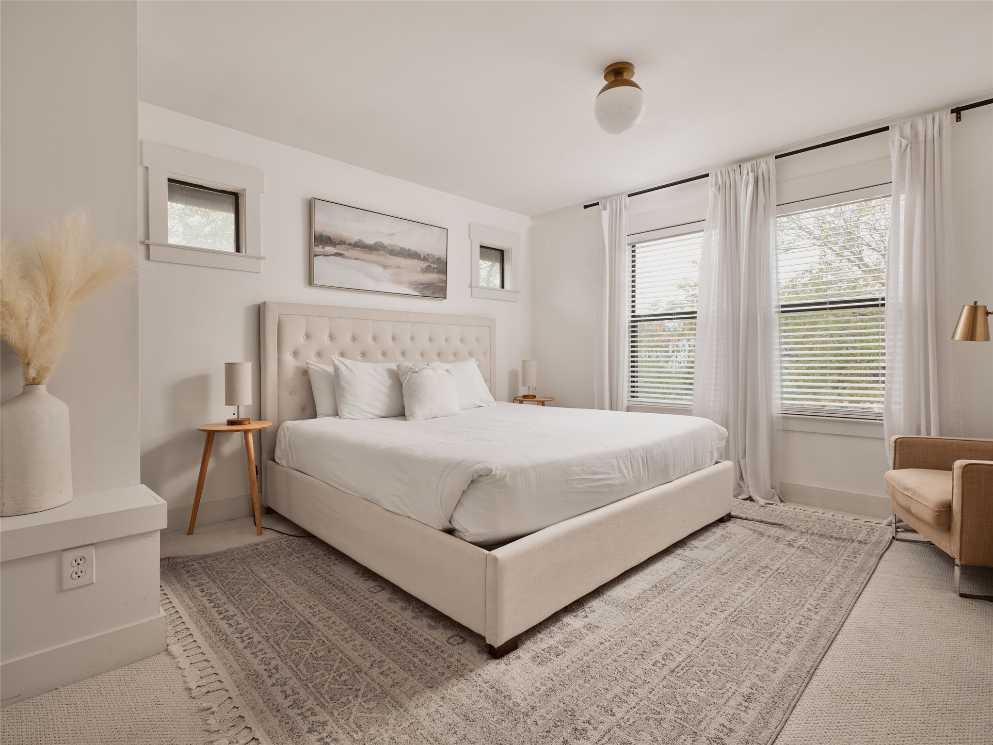 2002 East 13th Street, Unit A Austin, TX 78702 - Photo 19 of 37 Bedroom with multiple windows and carpet