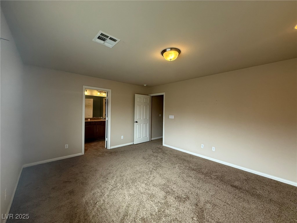 6830 Philharmonic Avenue Las Vegas, NV 89139 - Photo 12 of 28 Primary bedroom with ceiling light