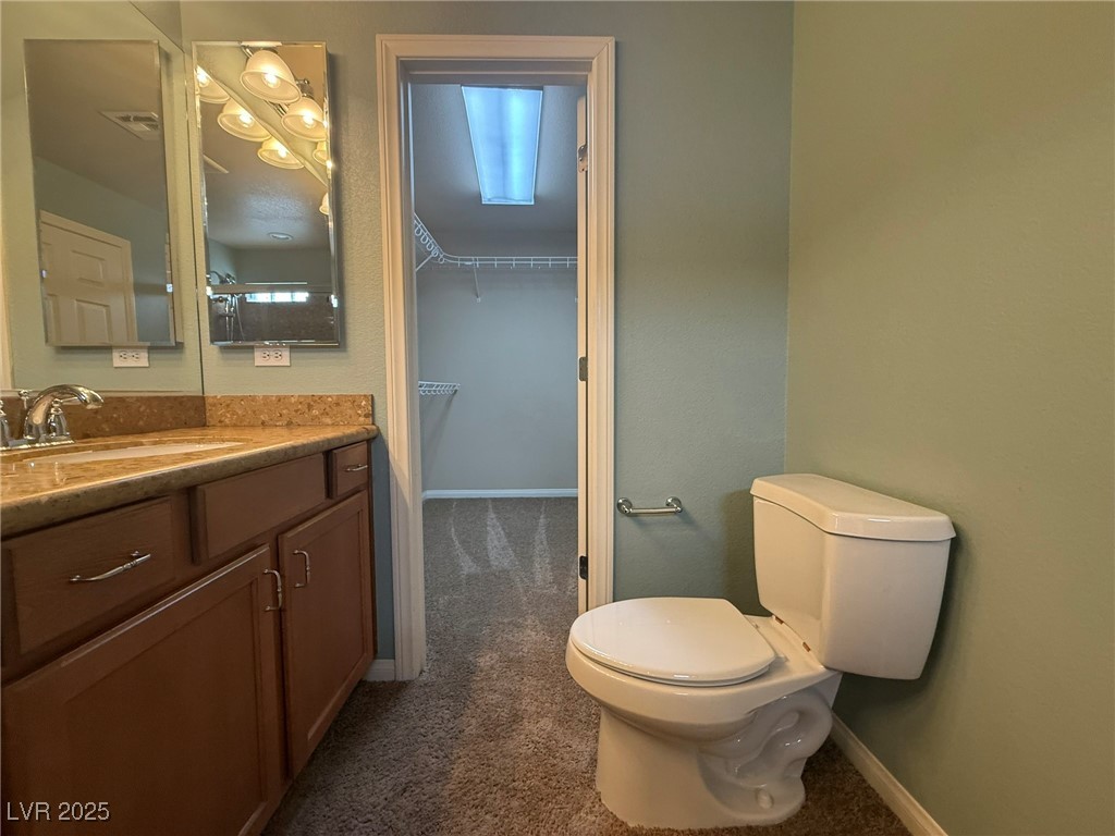 6830 Philharmonic Avenue Las Vegas, NV 89139 - Photo 14 of 28 Full bathroom featuring double sinks, shower, & va