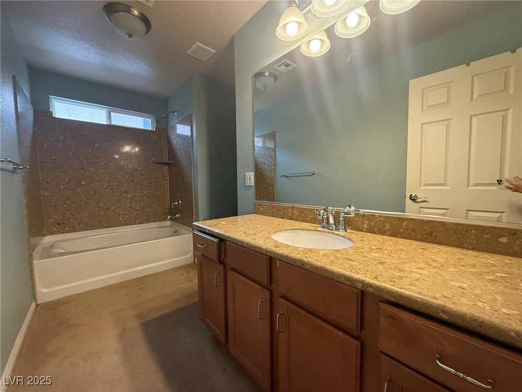 6830 Philharmonic Avenue Las Vegas, NV 89139 - Photo 20 of 28 Full bathroom with tub / shower combination, vanit