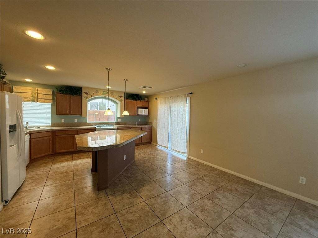 6830 Philharmonic Avenue Las Vegas, NV 89139 - Photo 5 of 28 Kitchen with white appliances, Living room with al