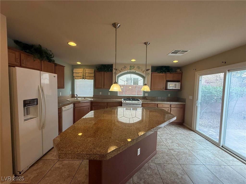 6830 Philharmonic Avenue Las Vegas, NV 89139 - Photo 6 of 28 Kitchen featuring light tile patterned floors, whi