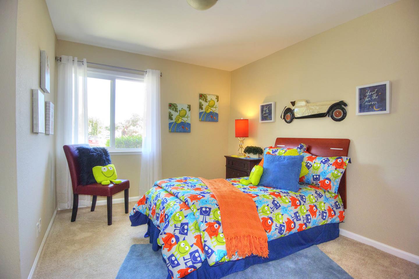3792 Savannah Road Fremont, CA 94538 - Photo 18 of 37 a bedroom that has a bed a table and a chair in it