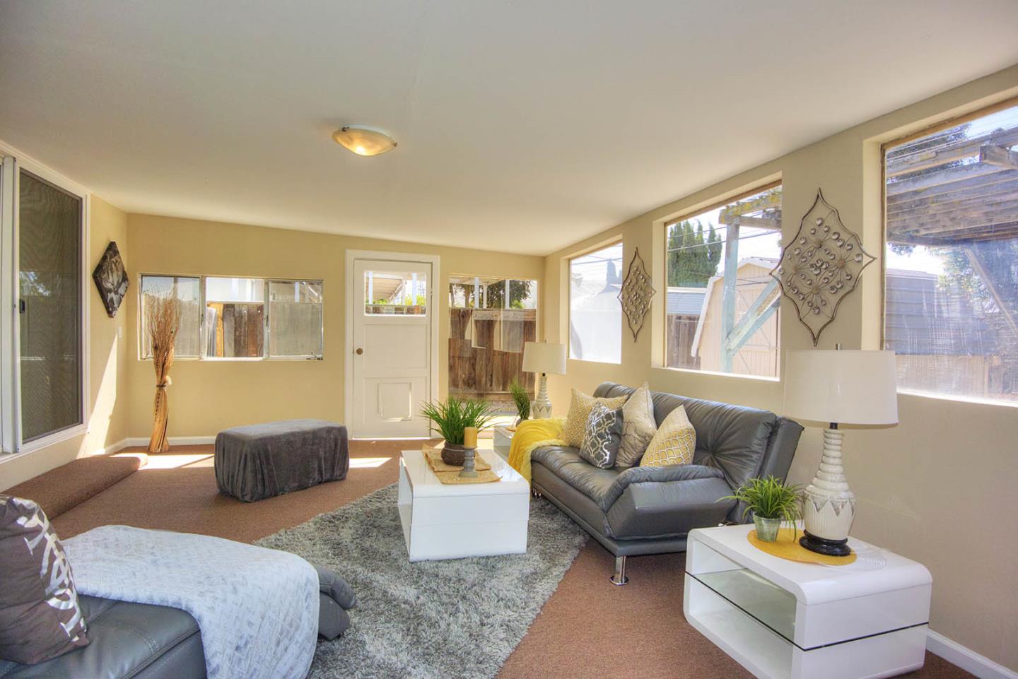 3792 Savannah Road Fremont, CA 94538 - Photo 26 of 37 a living room with furniture and a large window