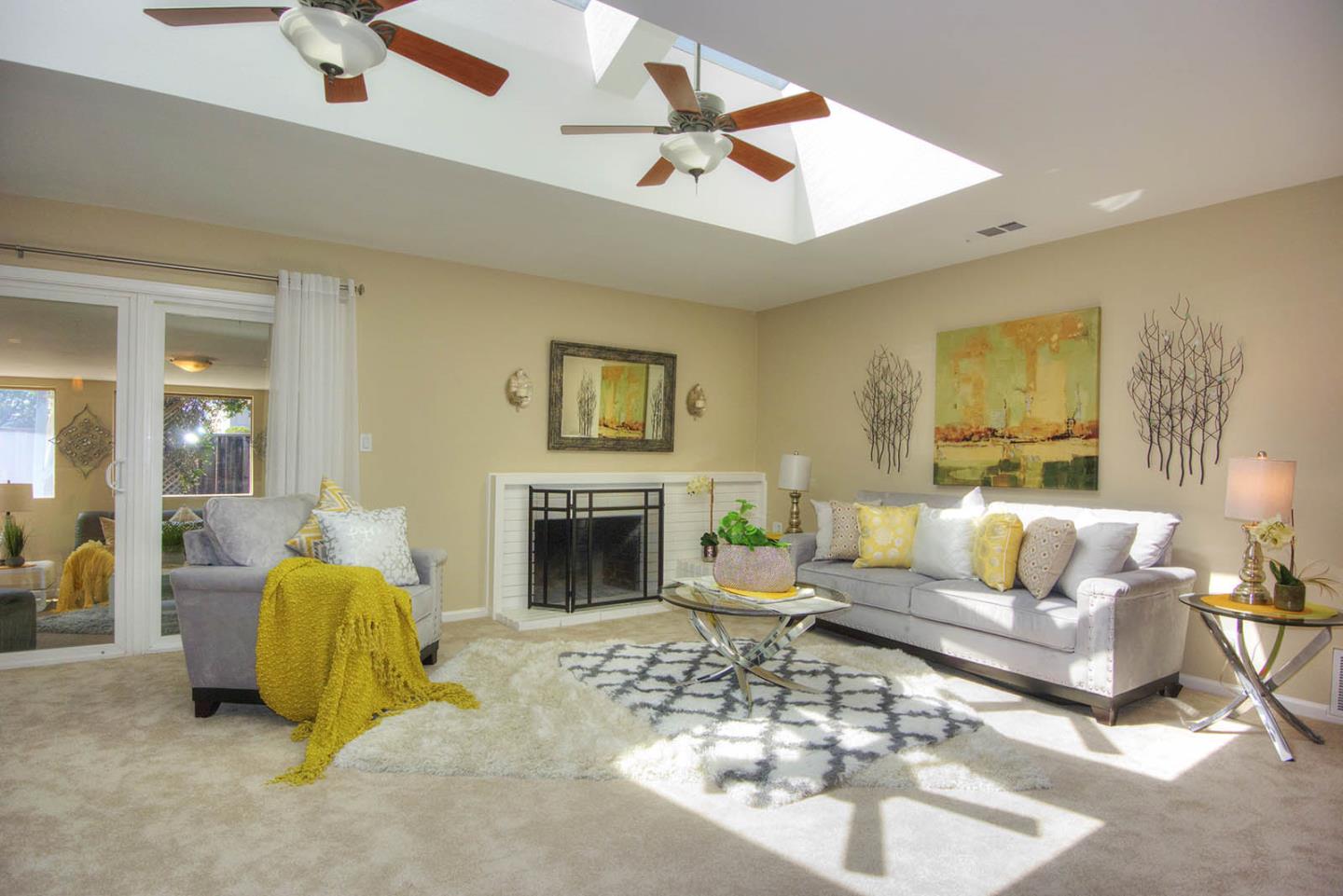 3792 Savannah Road Fremont, CA 94538 - Photo 3 of 37 a living room with furniture a rug and a fireplace