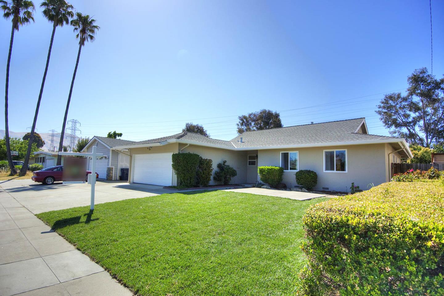 3792 Savannah Road Fremont, CA 94538 - Photo 36 of 37 a front view of a house with a yard and garage