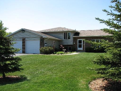 35040 North Wilson Road Ingleside, IL 60041 - Photo 1 of 1 a front view of a house with a garden and plants
