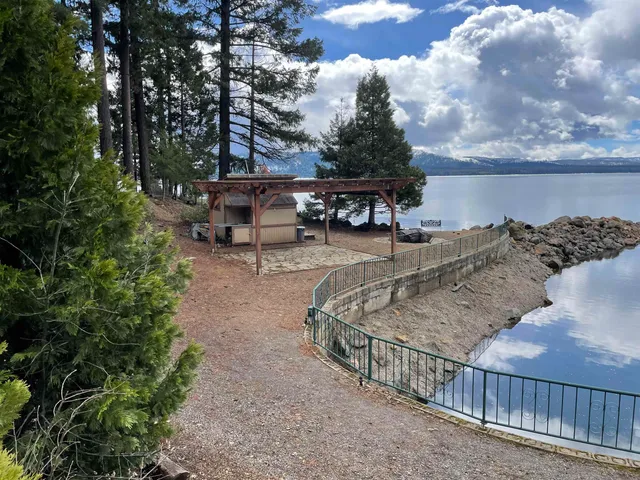 a view of a backyard with sitting area