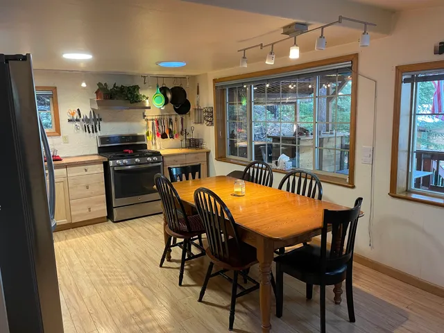 a view of a dining room with furniture window and outside view