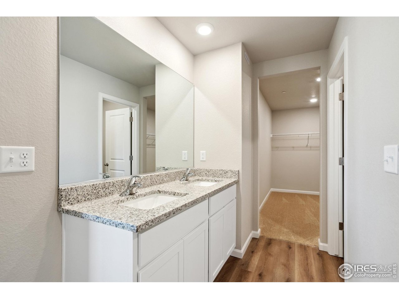 199 Robin Road Johnstown, CO 80534 - Photo 11 of 30 a bathroom with a sink and a mirror