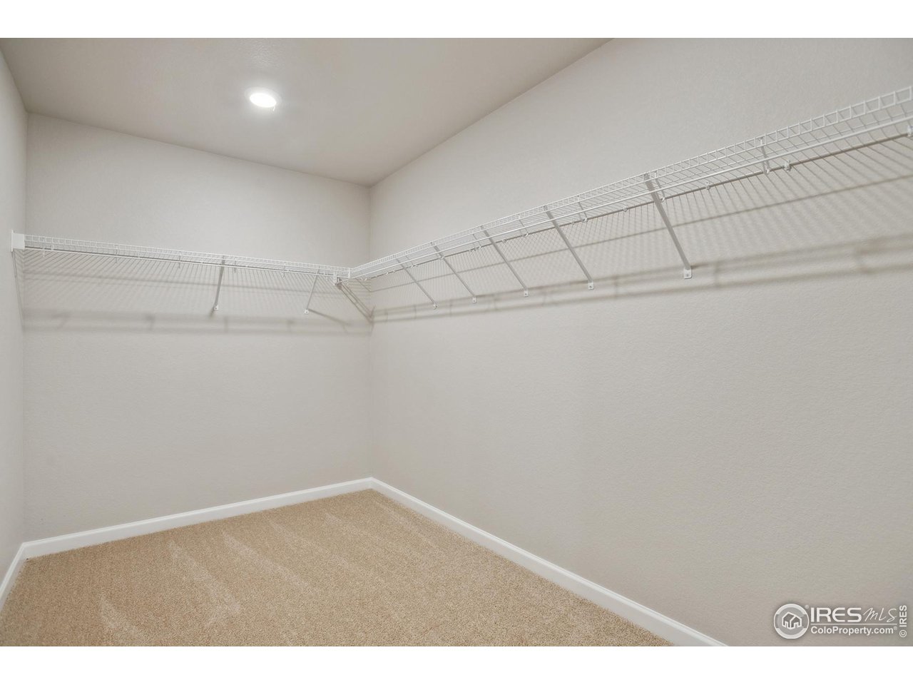 199 Robin Road Johnstown, CO 80534 - Photo 14 of 30 a view of a room with racks on the wall