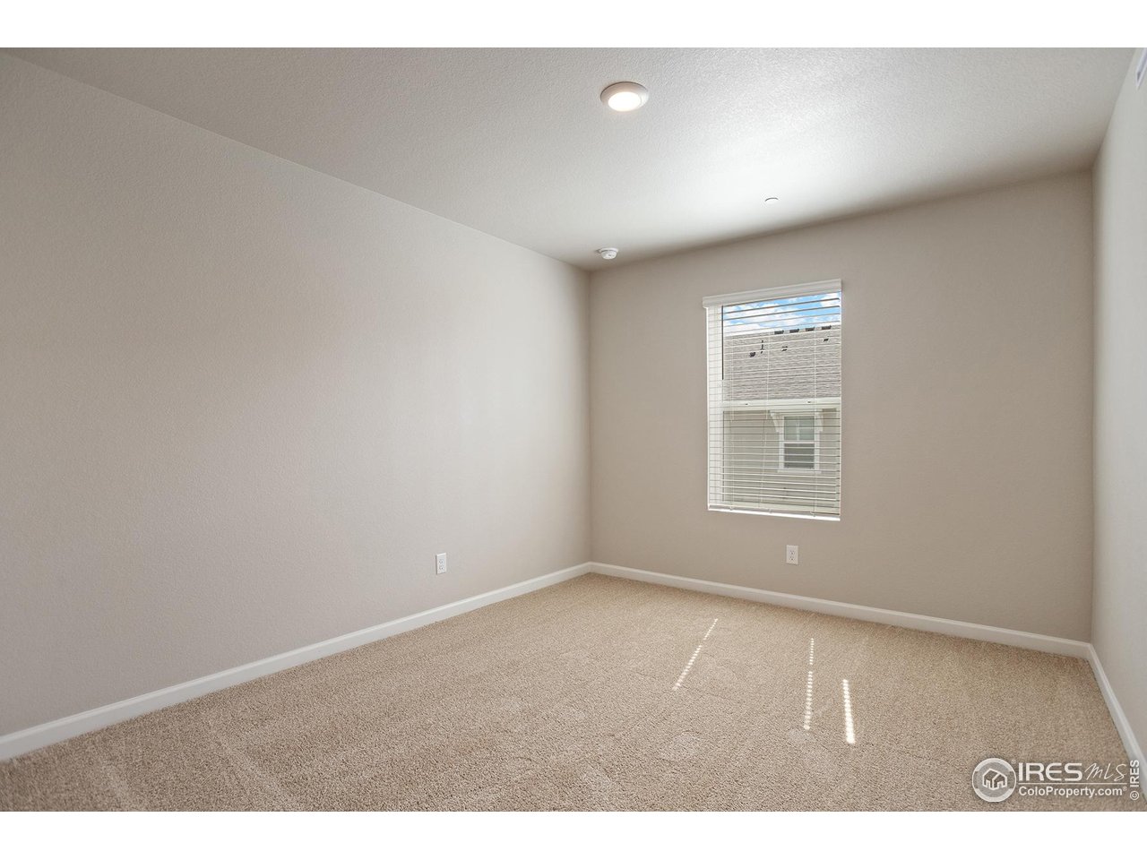 199 Robin Road Johnstown, CO 80534 - Photo 15 of 30 a view of an empty room with a window