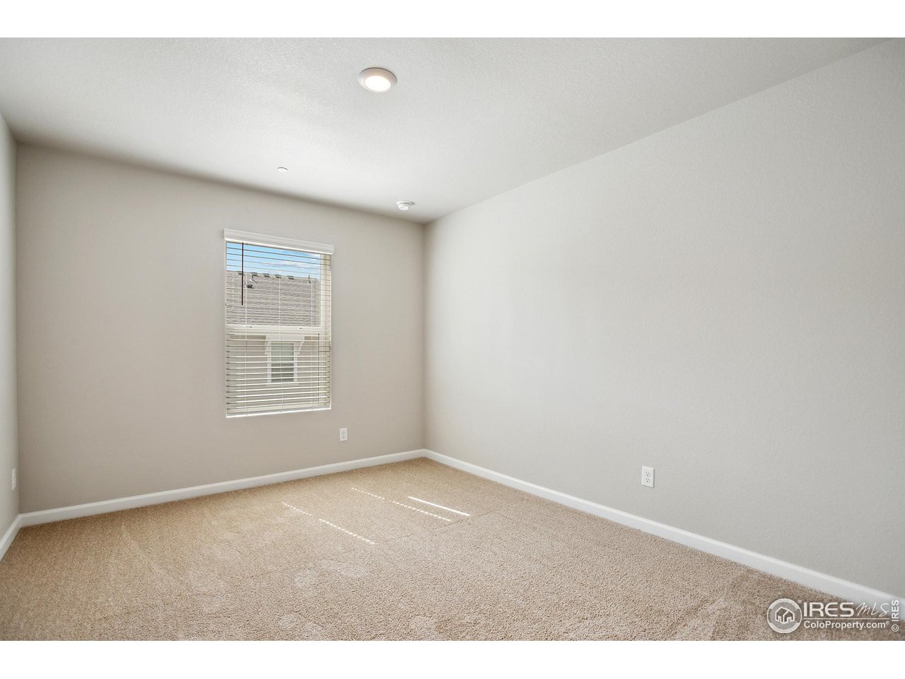 199 Robin Road Johnstown, CO 80534 - Photo 17 of 30 an empty room with windows