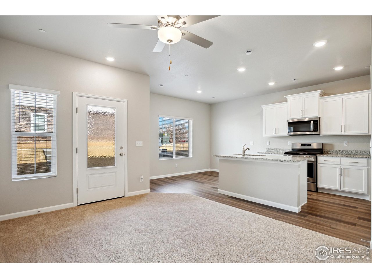 199 Robin Road Johnstown, CO 80534 - Photo 2 of 30 a view of kitchen with windows and ceiling fan
