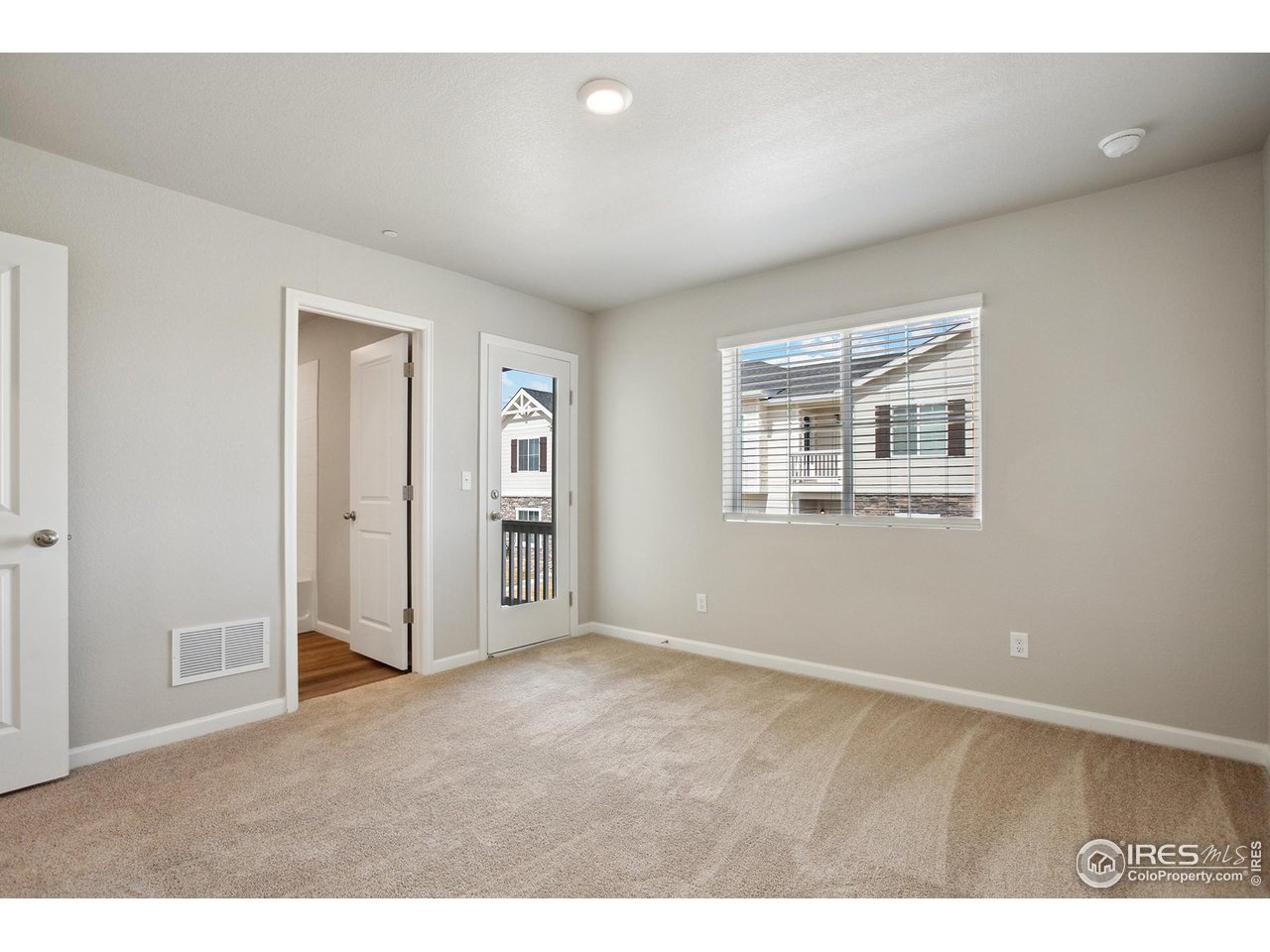 199 Robin Road Johnstown, CO 80534 - Photo 9 of 30 a view of an empty room with a window