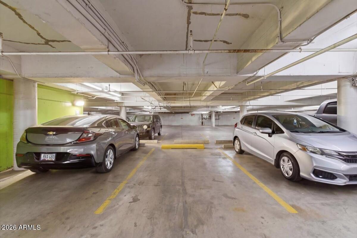 4750 North Central Avenue, Unit B14 Phoenix, AZ 85012 - Photo 28 of 57 a view of parking garage with cars parked