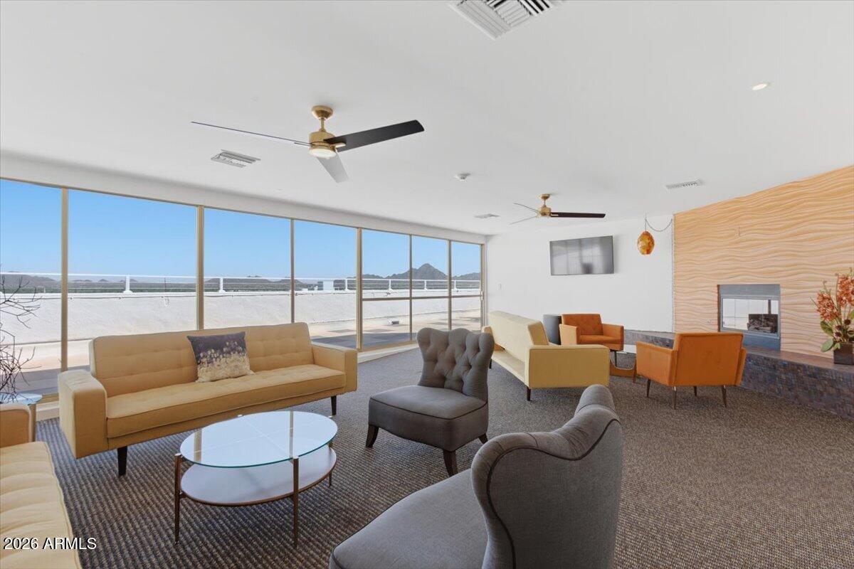 4750 North Central Avenue, Unit B14 Phoenix, AZ 85012 - Photo 30 of 57 a living room with furniture and a large window